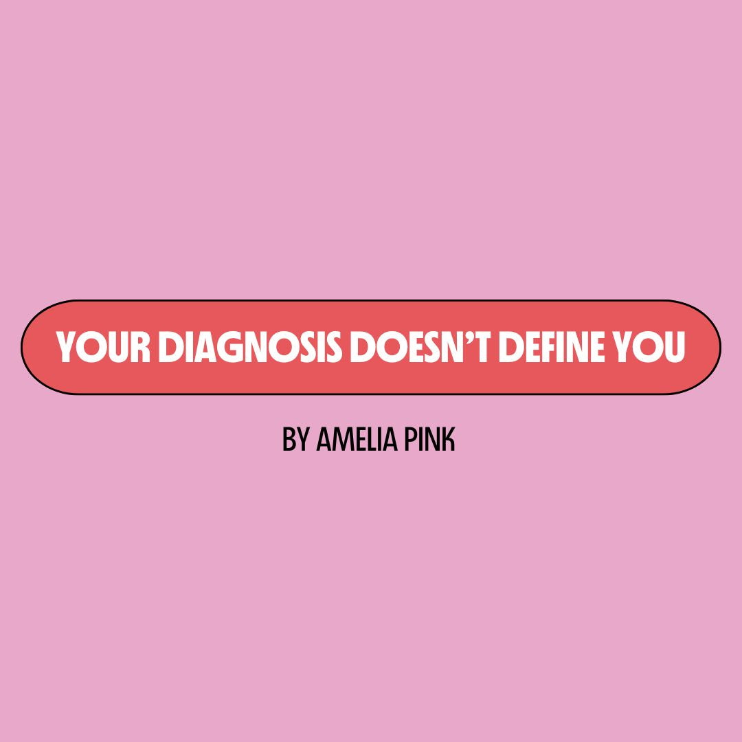 Pink background with a red text box containing white writing that reads: "your diagnosis doesn't define you." Underneath is black writing that reads: "by Amelia Pink."